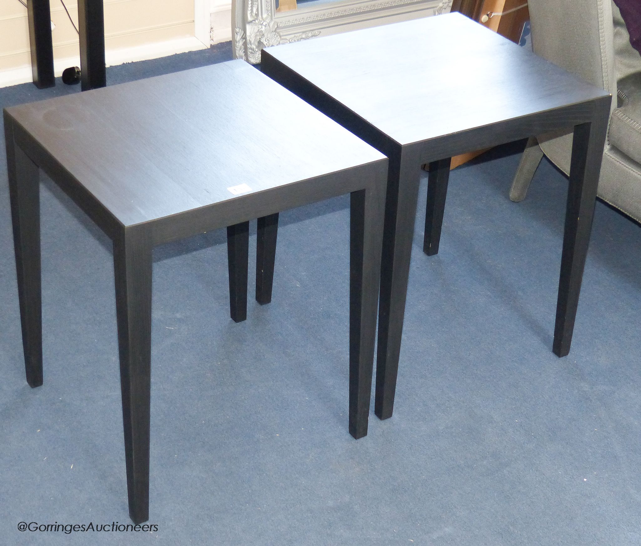 A pair of ebonised lamp tables, 45 cm wide, 55 cm high